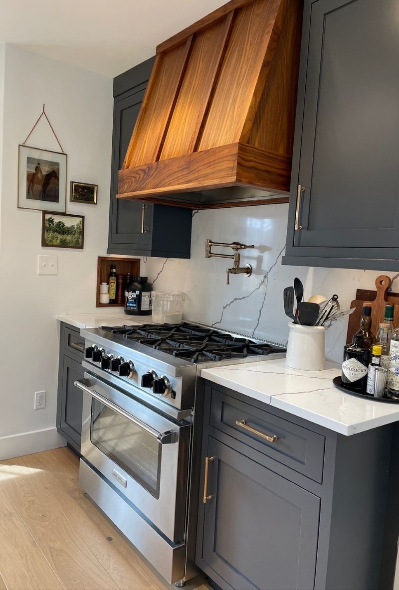 a kitchen with a wooden stove vent hood